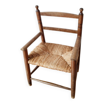 Vintage children's armchair in wood and straw