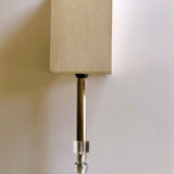 Silver floor lamp with a straight shade.