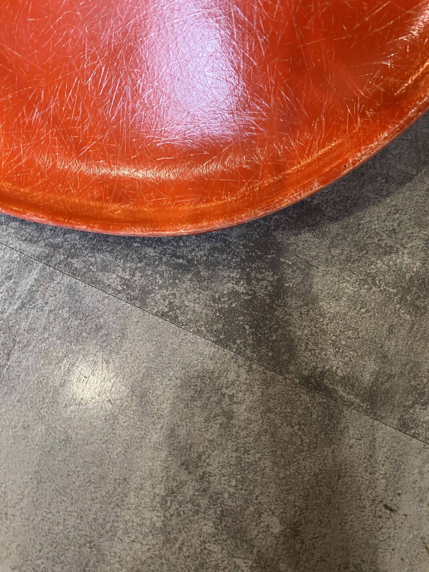 A vintage 70s Eames Herman Miller DSW Fiber Red Orange Dowel Walnut Chair