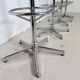 1970s chrome bar stools with cognac-colored faux leather upholstery