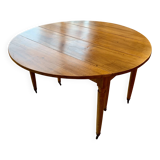 Extendable round table in solid walnut, 125cm in diameter, 5 extensions.