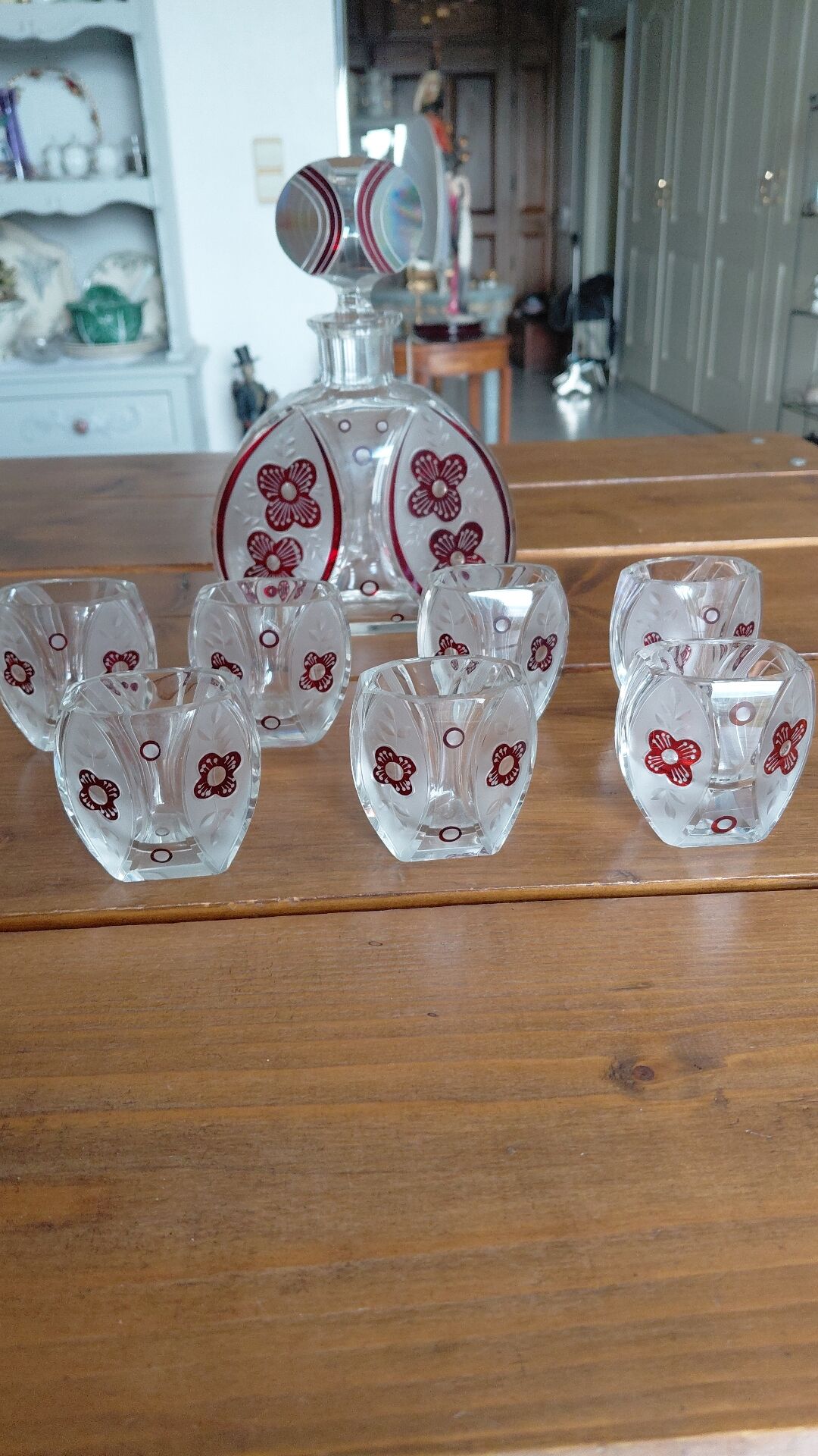 Vintage liqueur service in decorated red glass – decanter and 7 glasses
