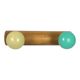 Vintage wall coat rack with 2 yellow and green balls.