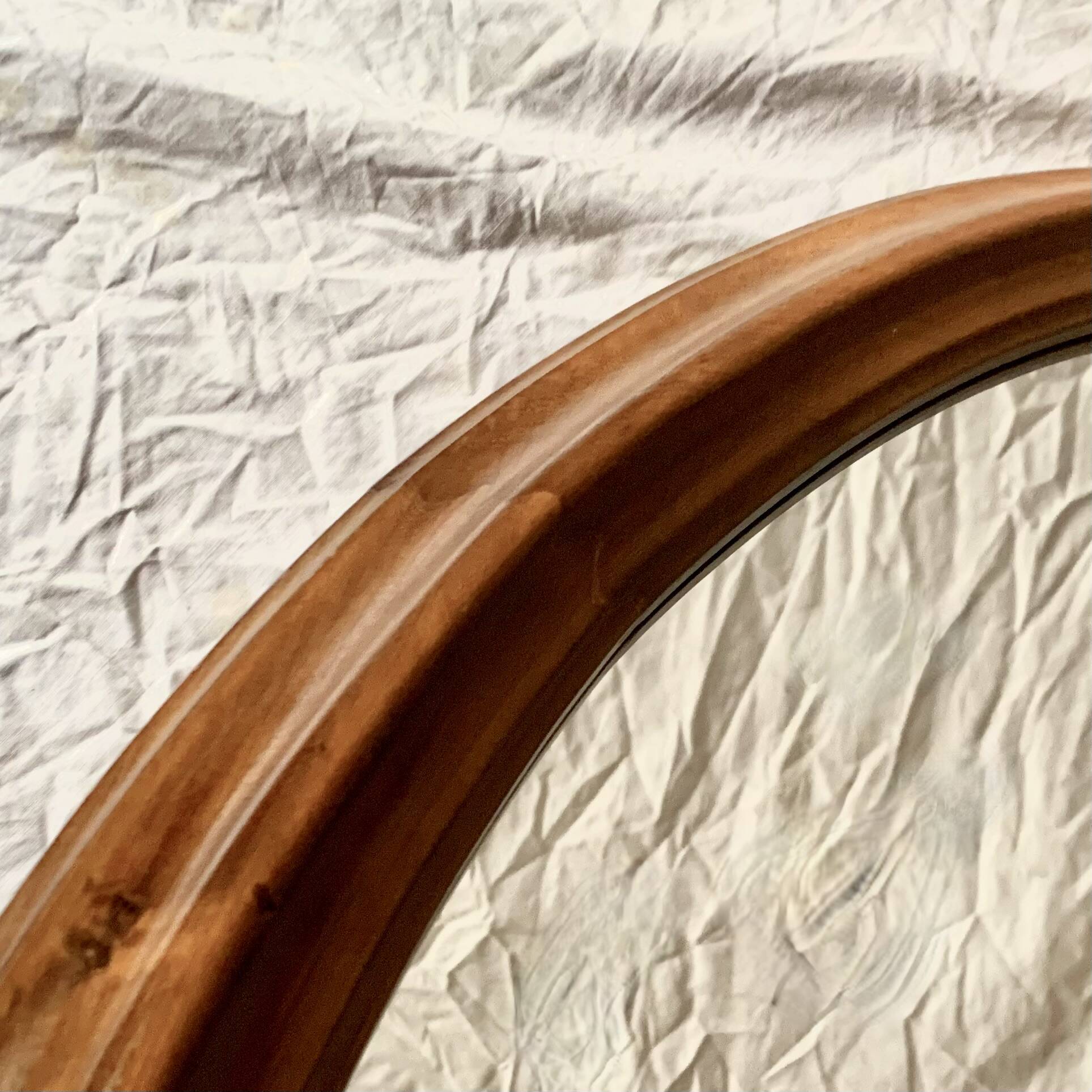 Old large oval wooden wall mirror
