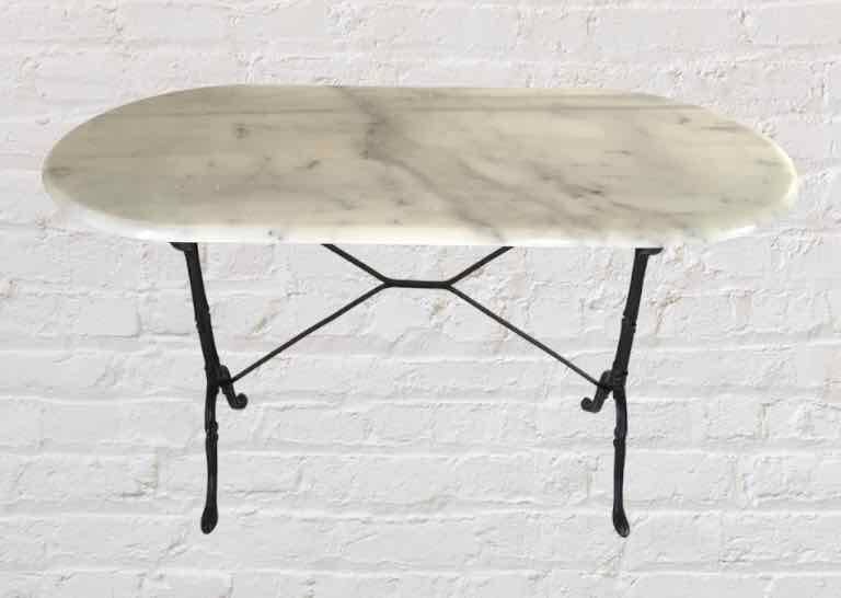 Oval marble and cast iron bistro table