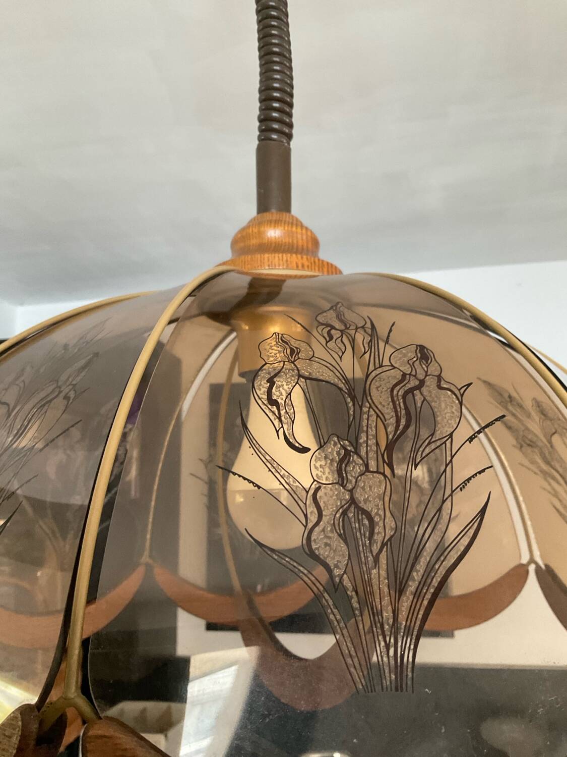 Scandinavian style glass and wood pendant light.