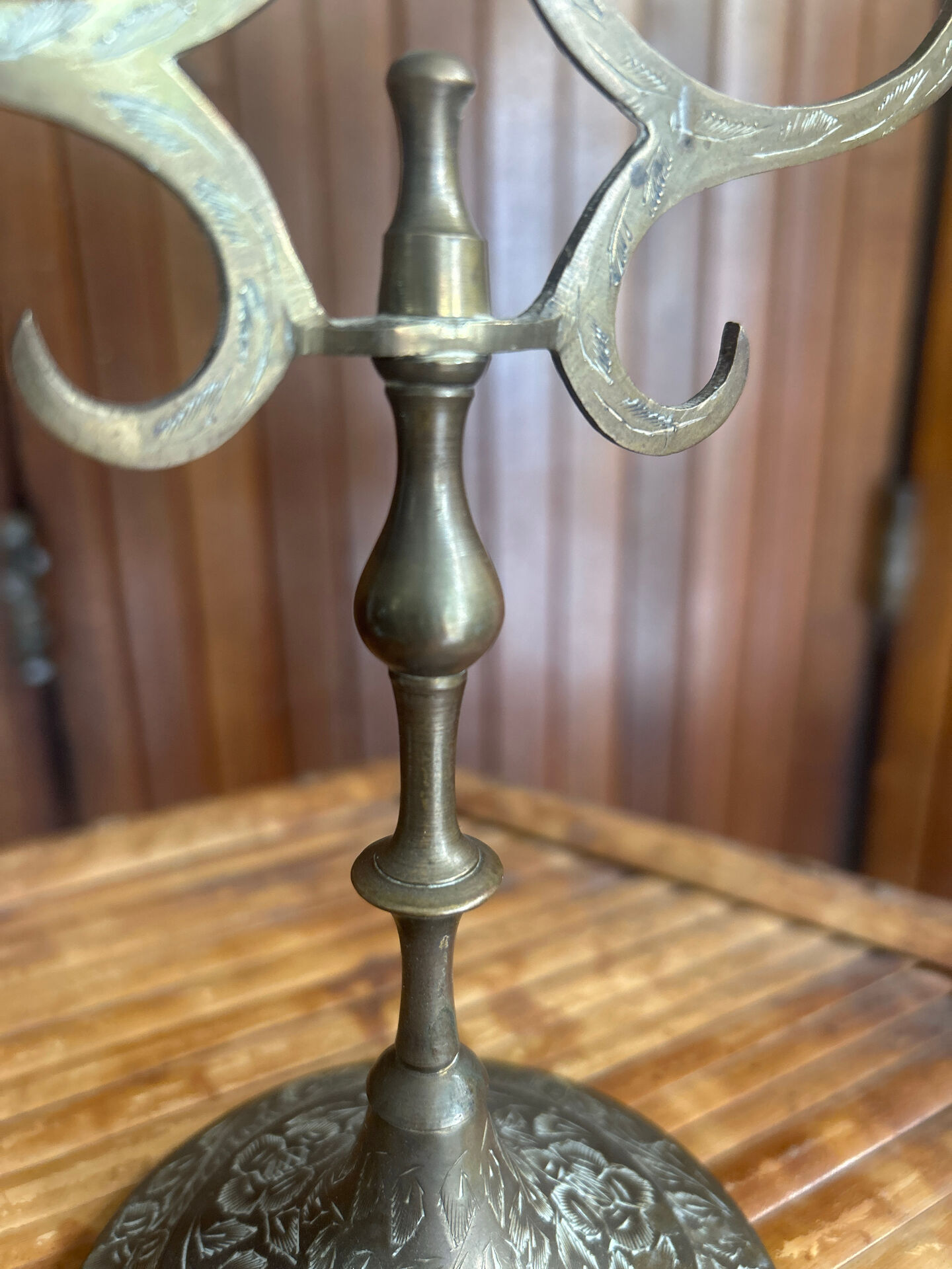 Vintage brass candelabrum engraved with three lights and a snuffer.