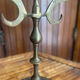 Vintage brass candelabrum engraved with three lights and a snuffer.