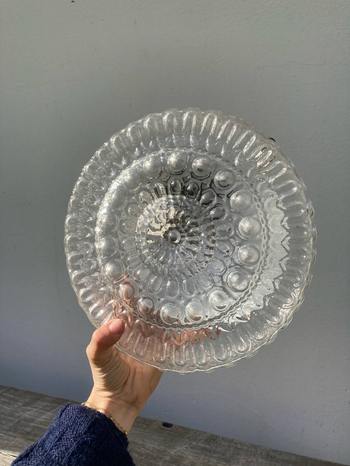 Pair of transparent round glass wall lights