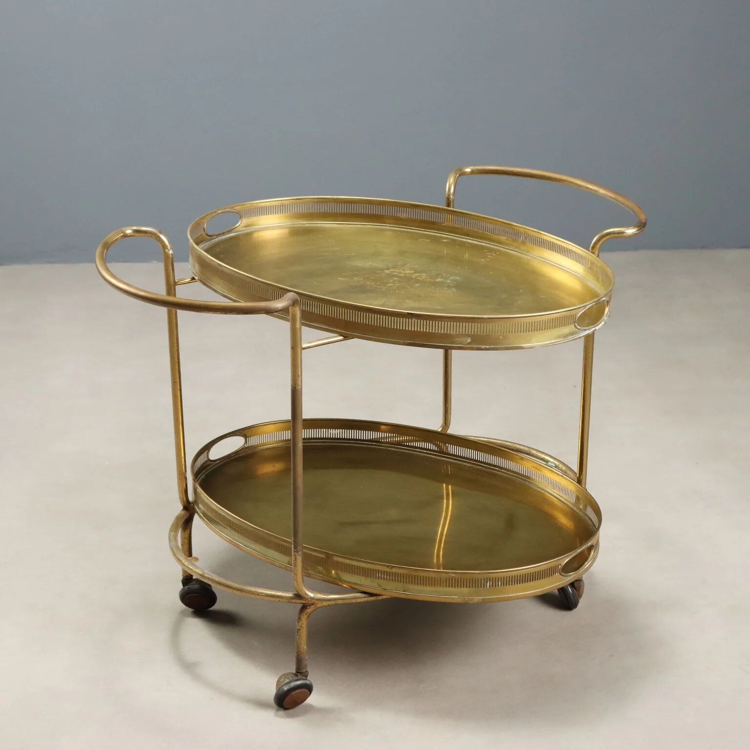 Vintage double-tier brass serving trolley, 1950s design.