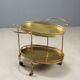 Vintage double-tier brass serving trolley, 1950s design.