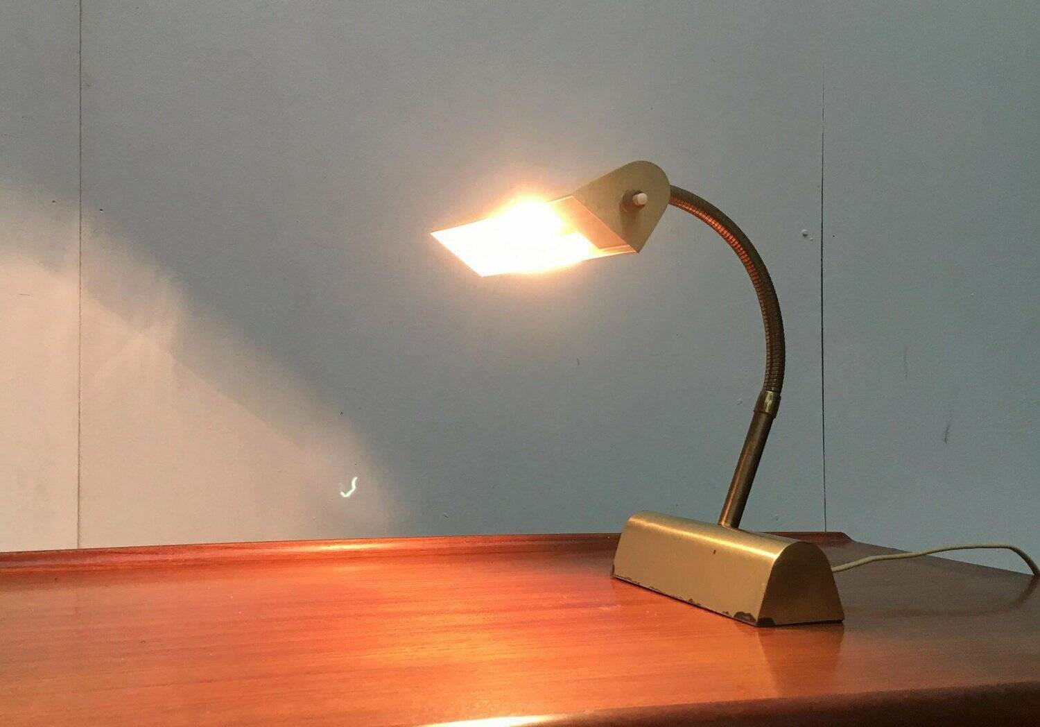 Mid-century brass swan neck table lamp in Hollywood Regency style from the 1960s.