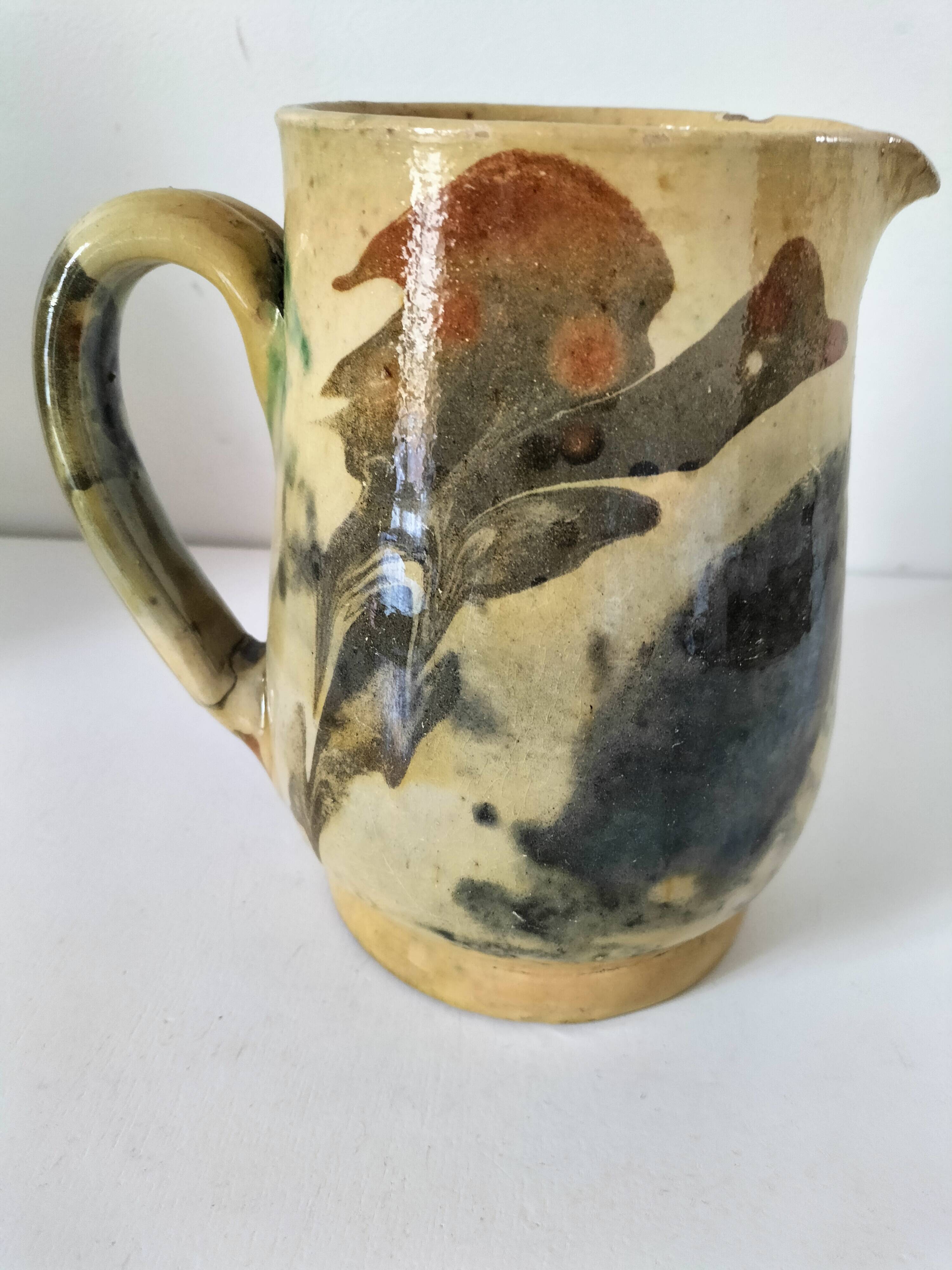 Glazed earthenware pitcher with abstract polychrome decoration, handmade.