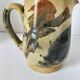 Glazed earthenware pitcher with abstract polychrome decoration, handmade.