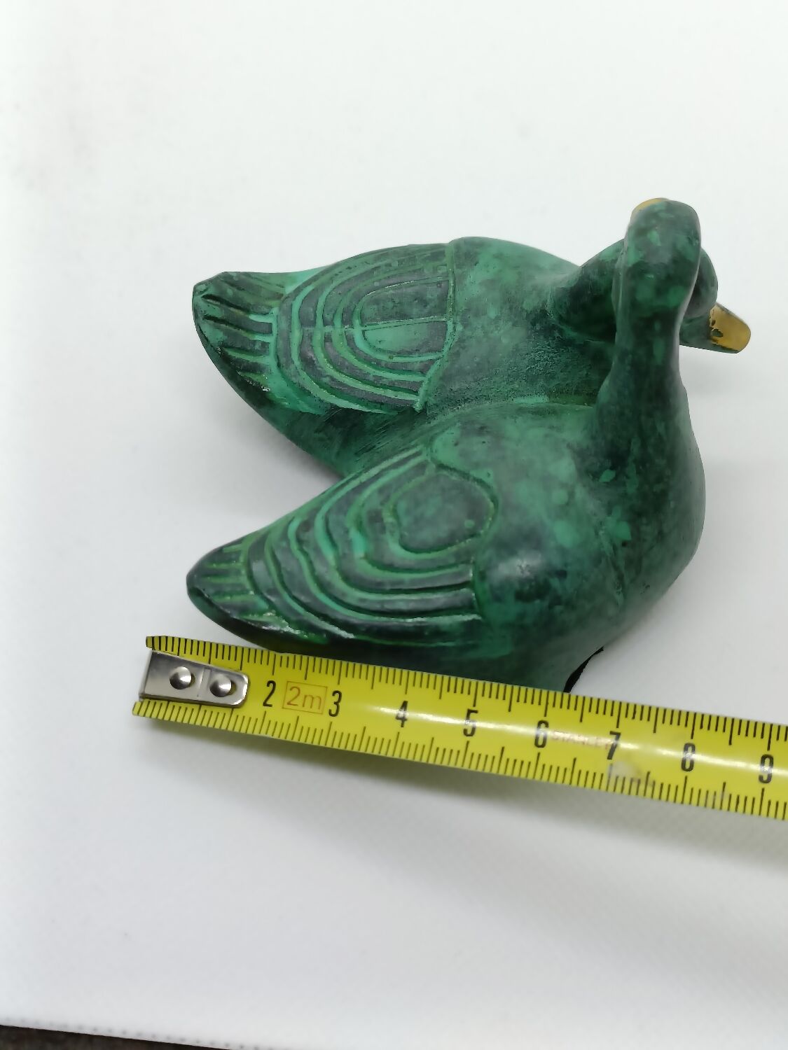 Two green and golden ducks in brass