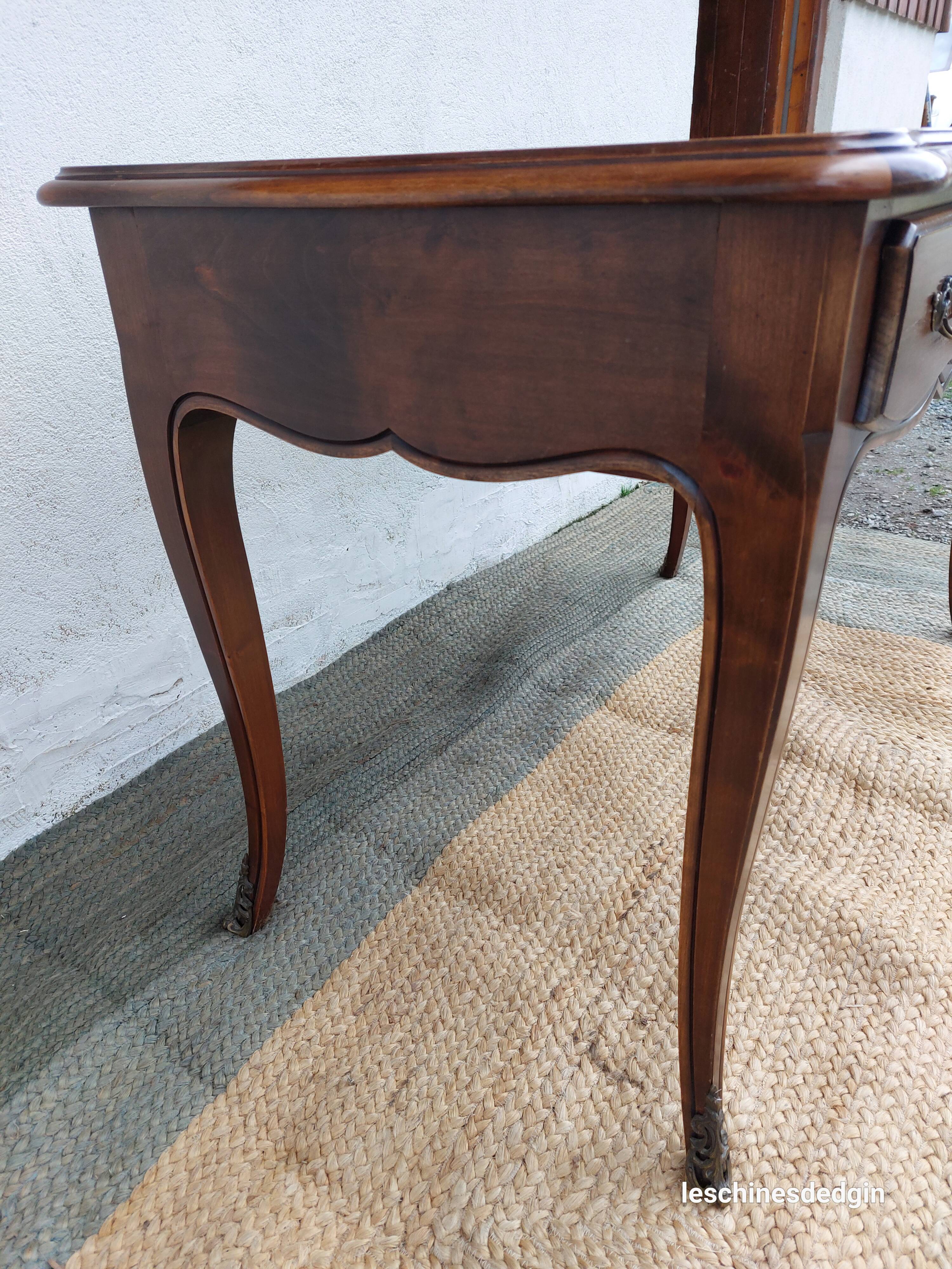 Louis XV style desk in wood, with a brown leather top.