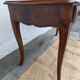 Louis XV style desk in wood, with a brown leather top.