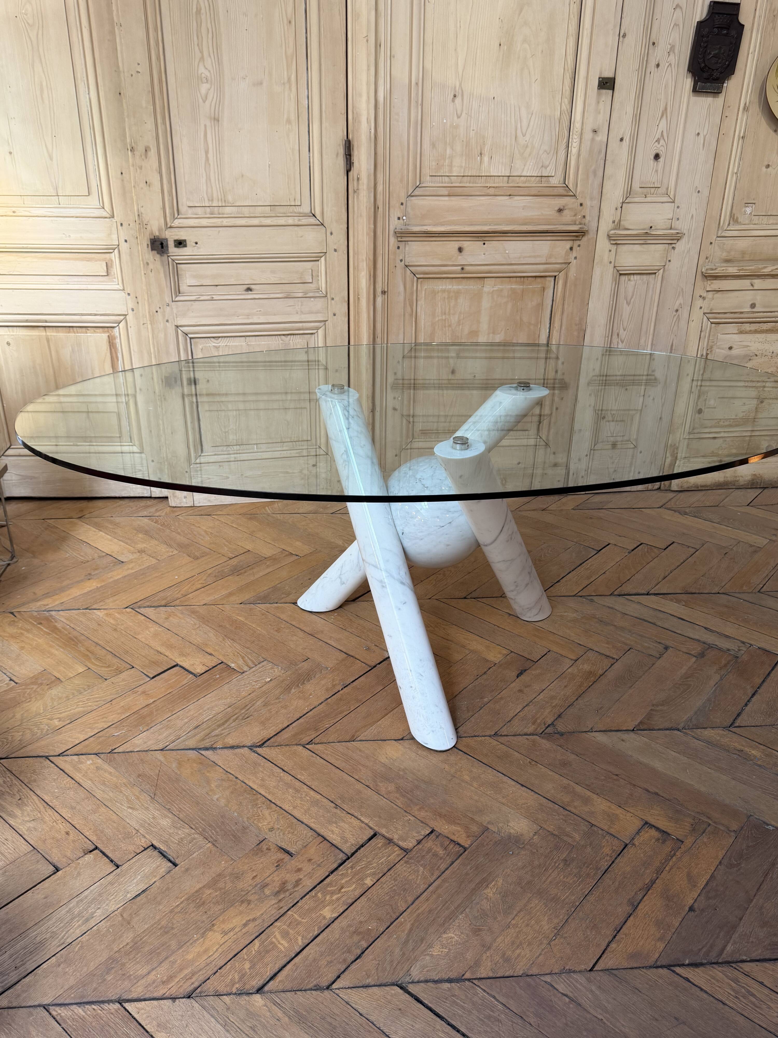 Dining table with glass top and marble base, Ligne Roset.