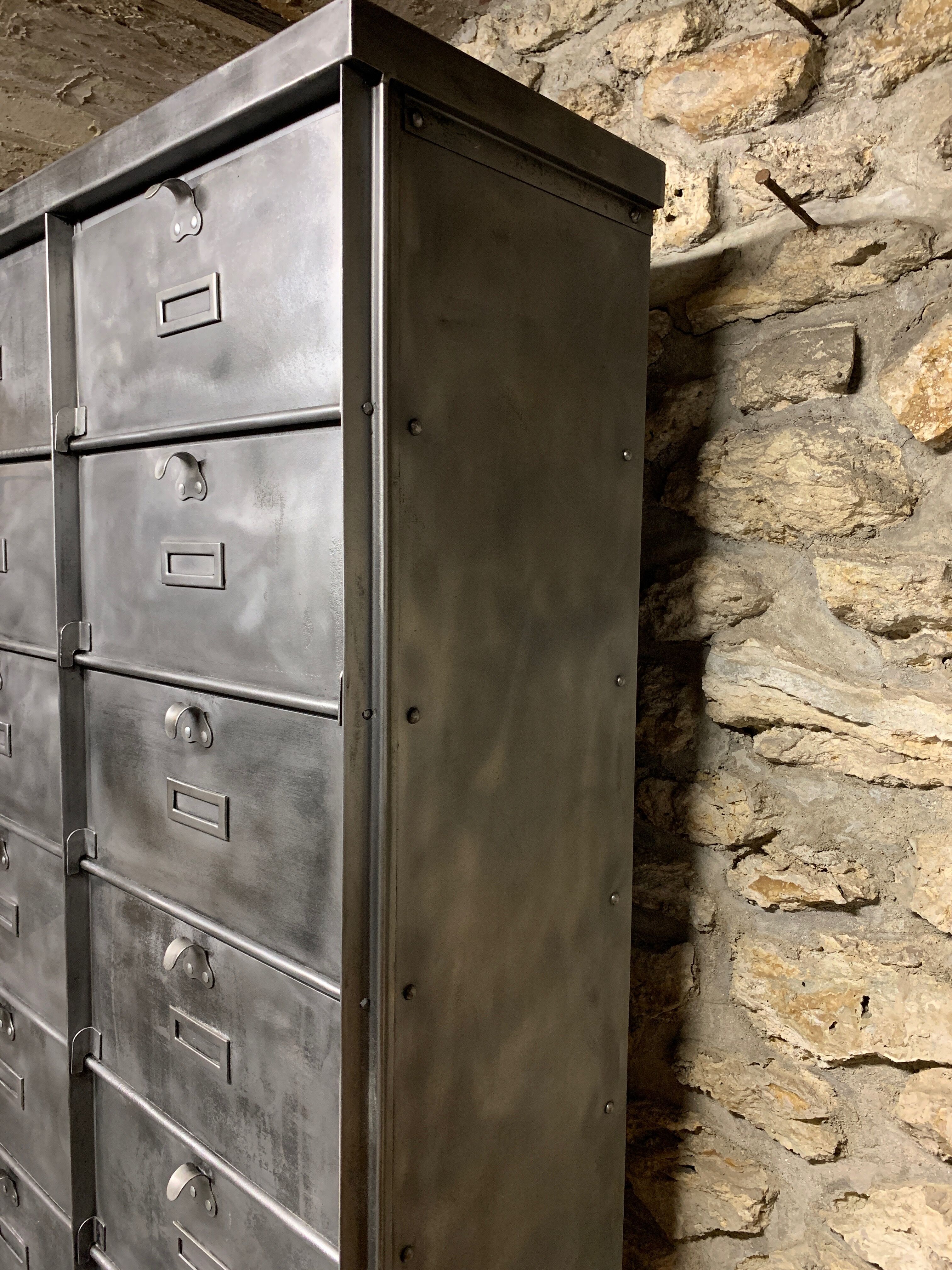Industrial cladding furniture in brushed and patinated steel
