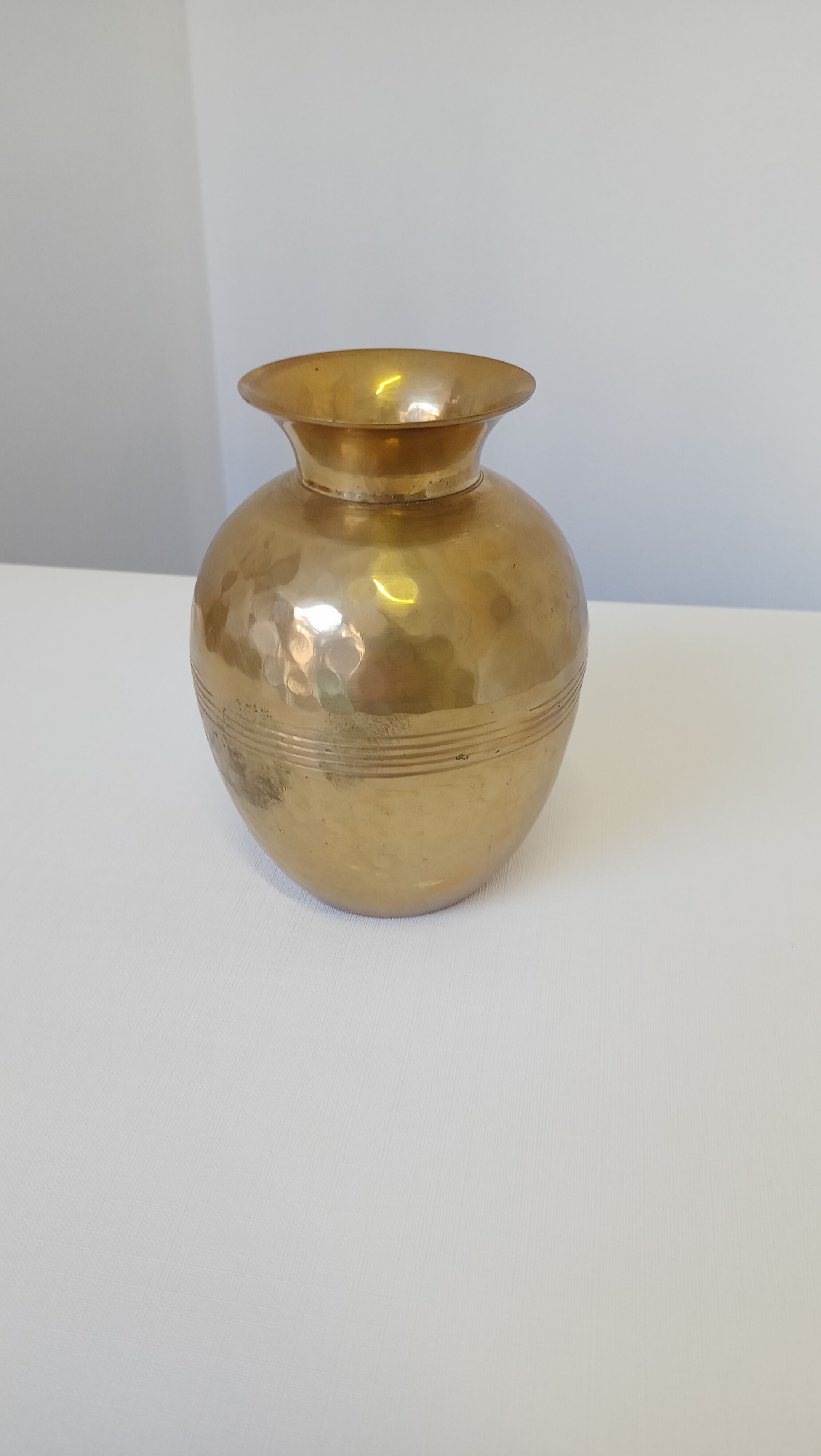 Hammered golden vase