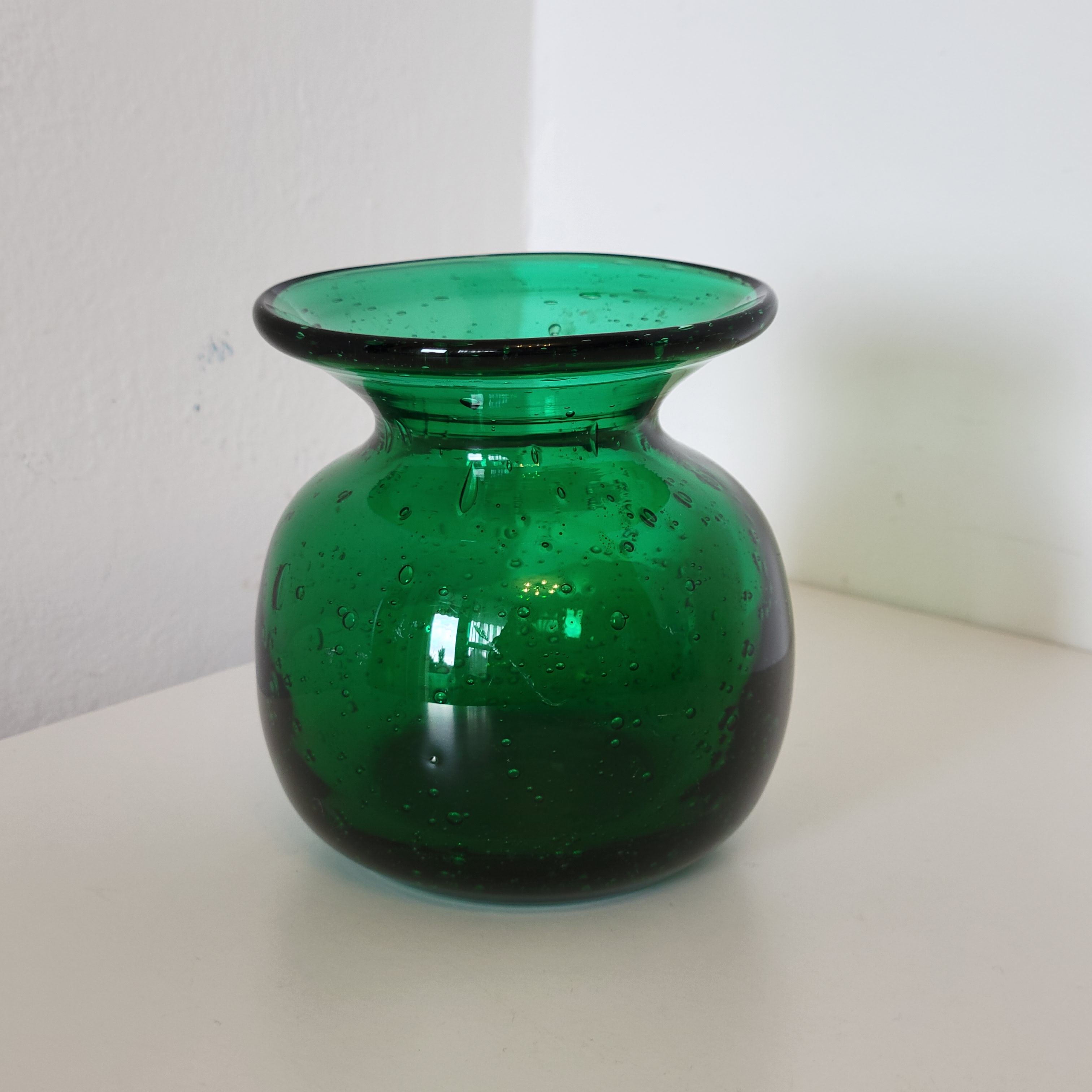 Small green bubbled blown glass vase