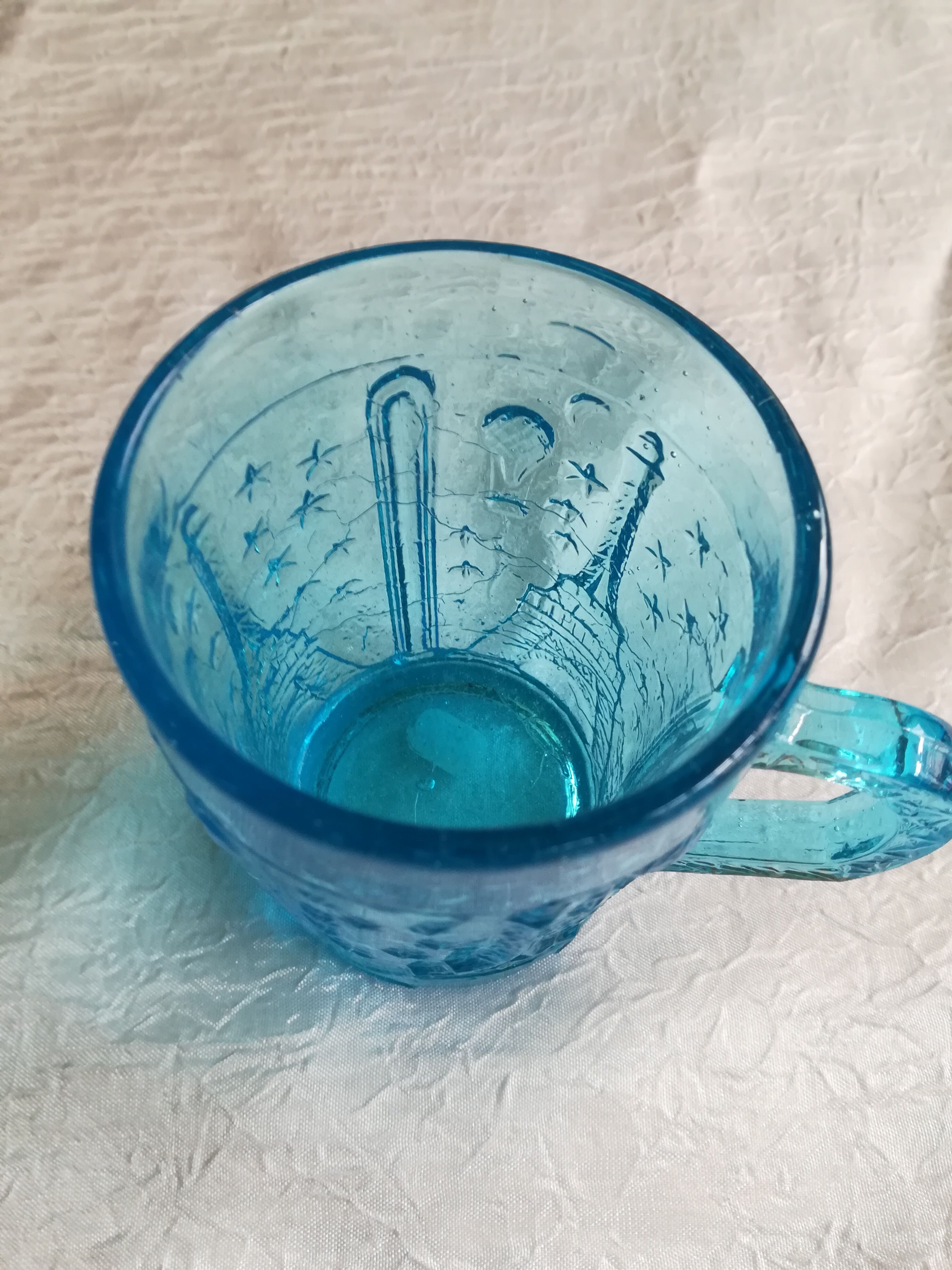 Old turquoise glass cup