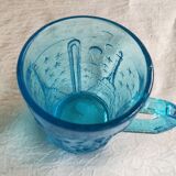 Old turquoise glass cup