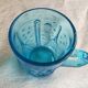 Old turquoise glass cup