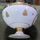 Empire-style footed cup in white porcelain, richly decorated with fine gold.
