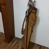 Old golf bag with 5 golf clubs