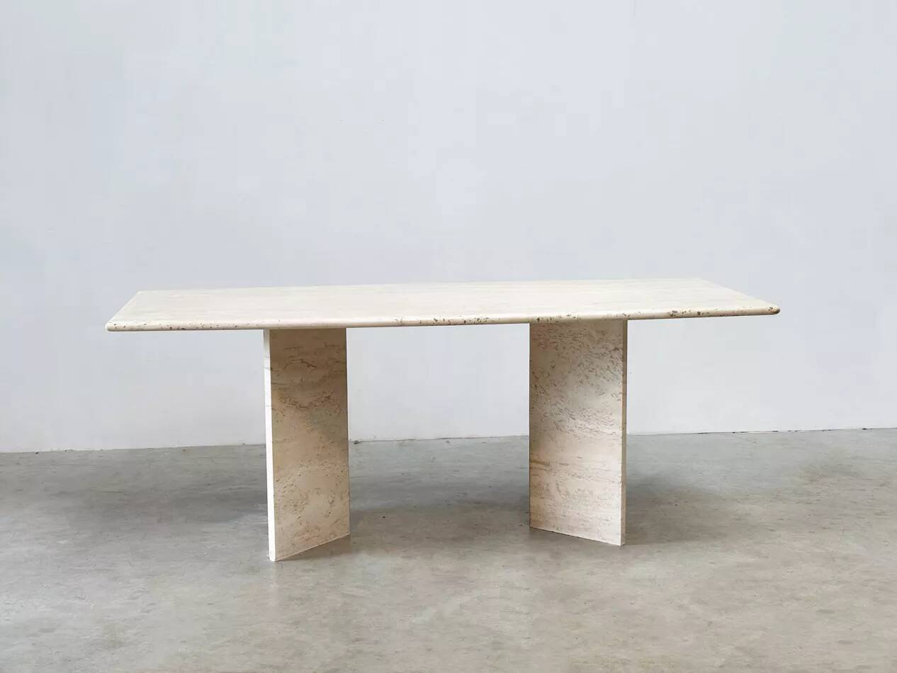 Sculptural travertine dining table