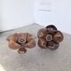 Pair of wooden flower wall lights from the 1970s.