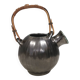 A ceramic jug with a metallic glaze and a handle made of woven raffia.