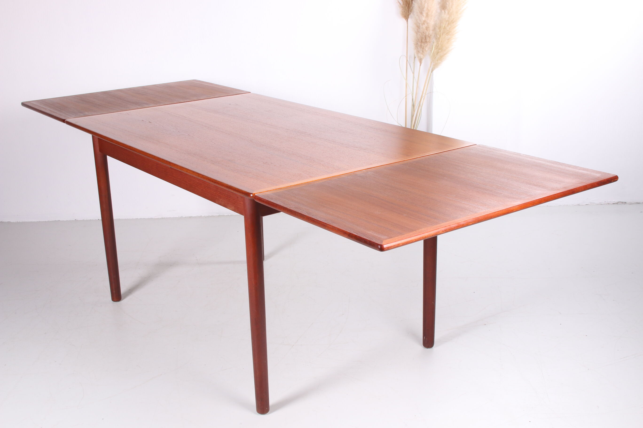 Danish teak draw-leaf dining table