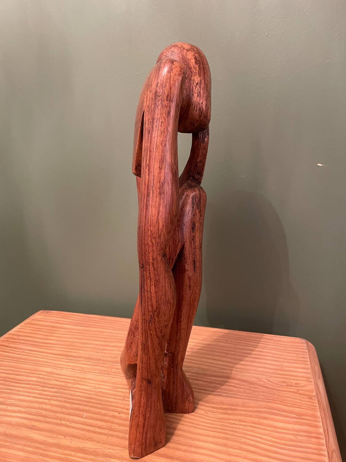 Wooden sculpture inspired by Rodin's "The Thinker"