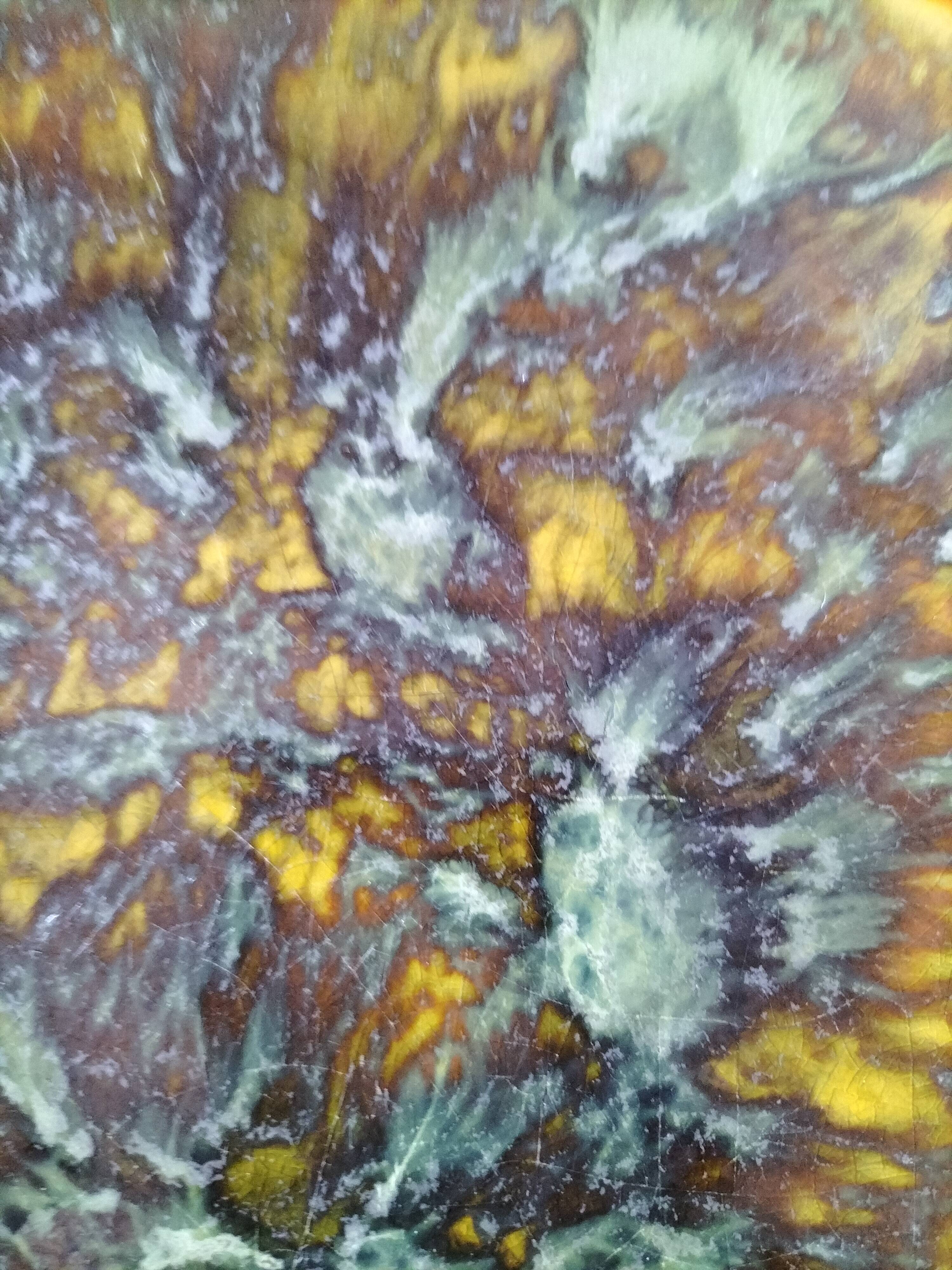 Set of 4 flamed enamel plates in green and amber from the 60s-70s.