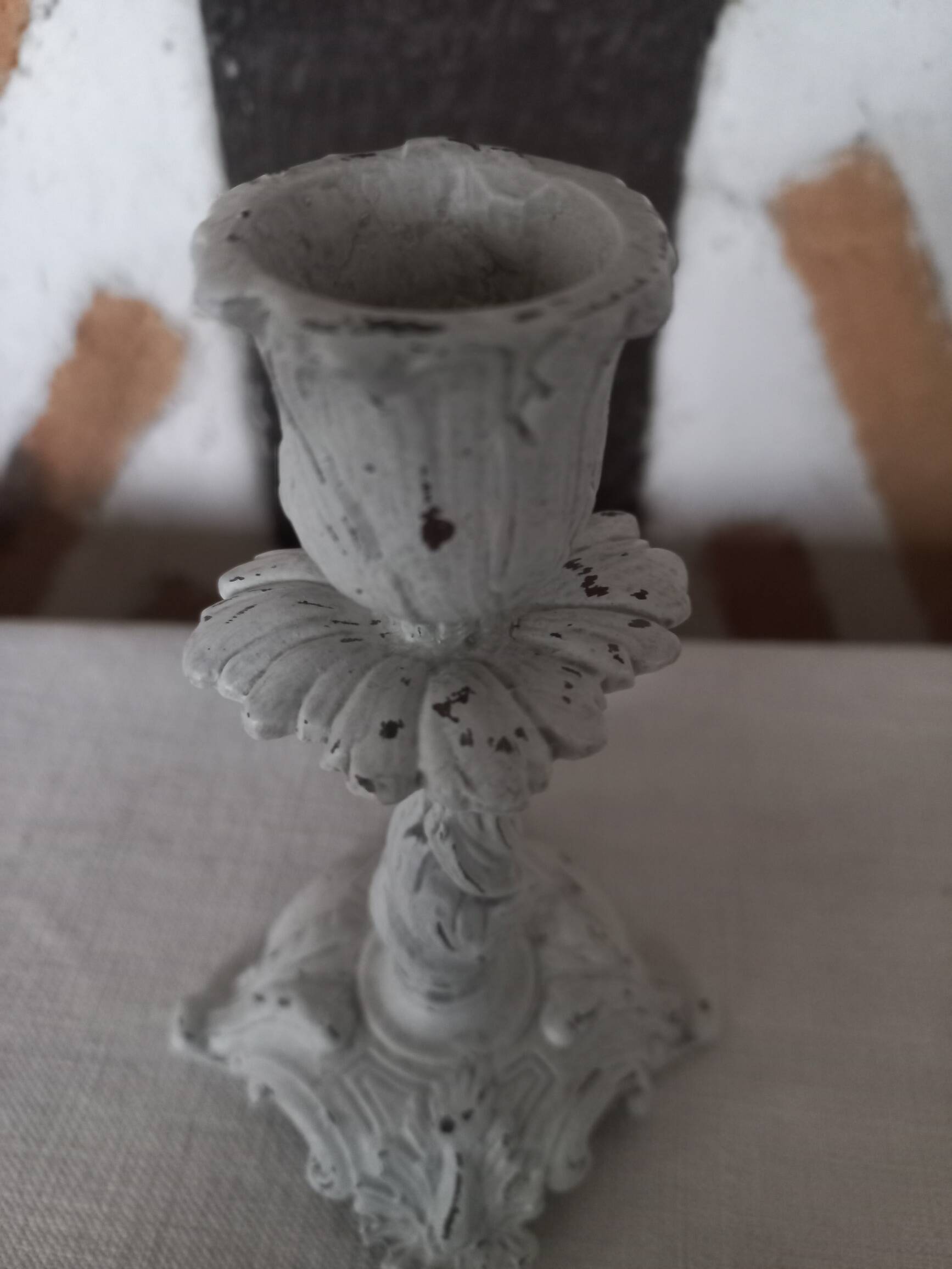 Old grayed white patinated candle holder