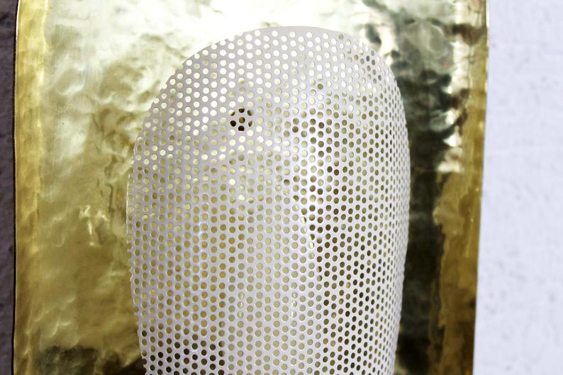 Hammered brass and perforated metal sconce
