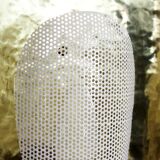 Hammered brass and perforated metal sconce