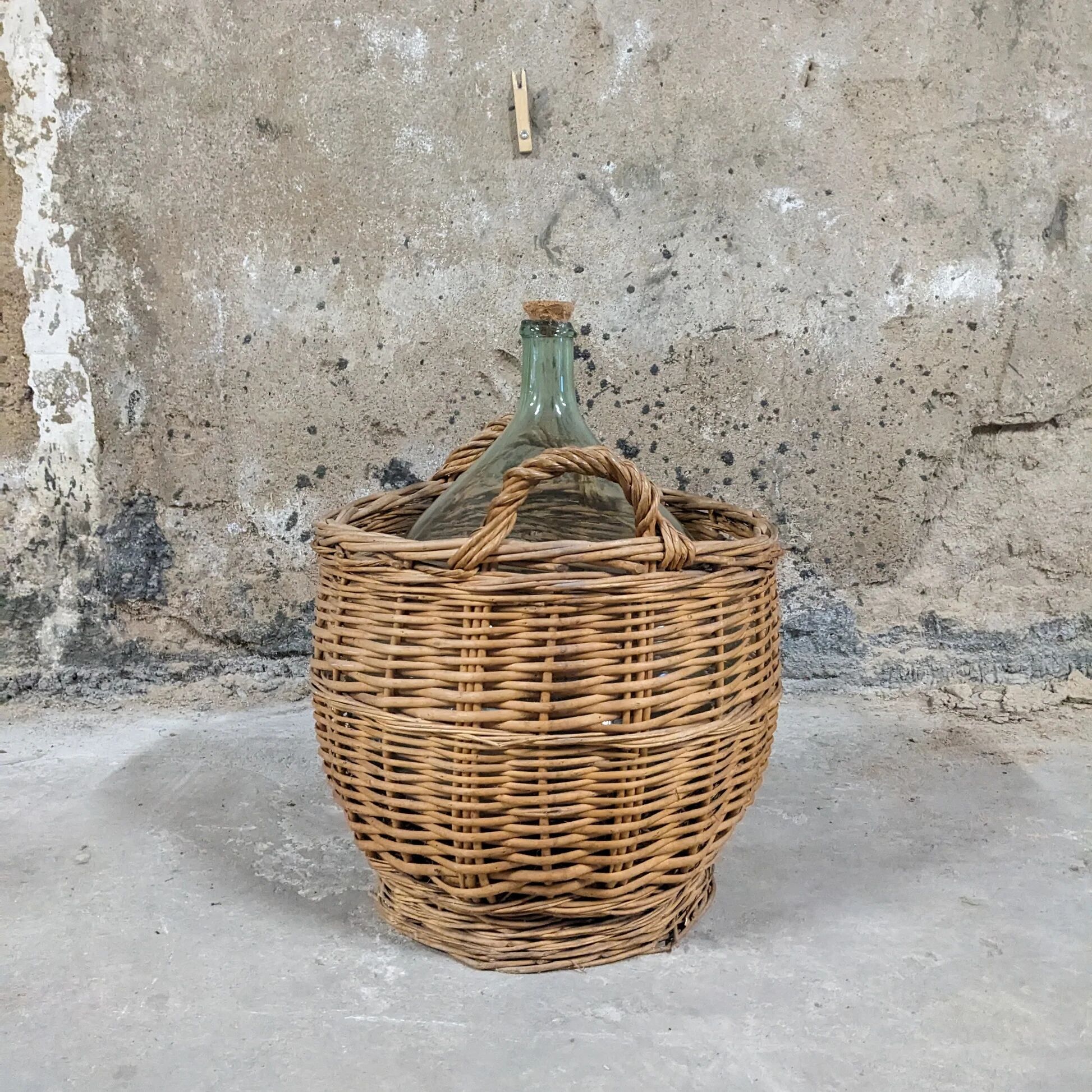 Demijohn in its wicker basket