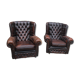 Padded chesterfield leather armchairs