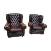 Padded chesterfield leather armchairs