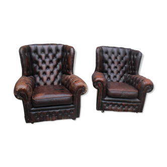 Padded chesterfield leather armchairs