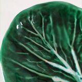 Vintage green slipware bowl in the shape of a cabbage leaf.