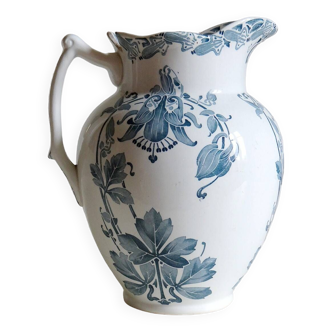 Large old earthenware jug with Columbine motifs