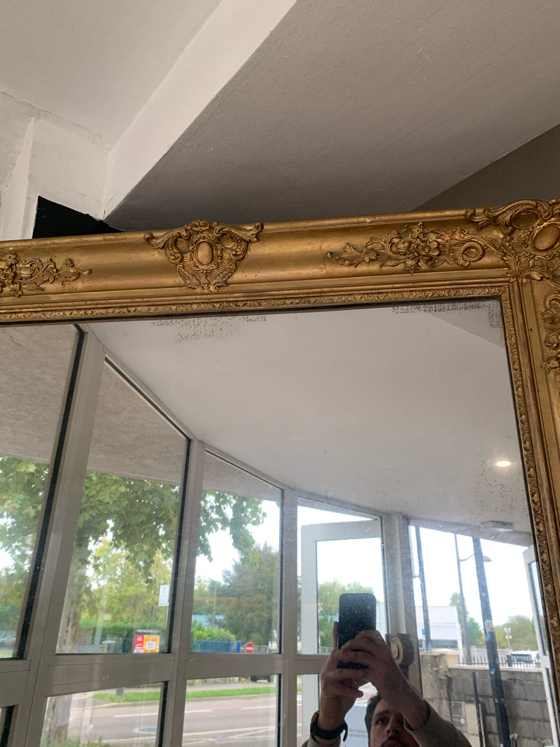 Old gilded mirror fireplace, 19th century restoration
