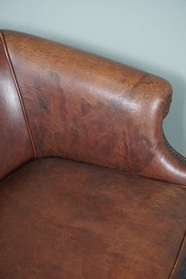 2-seater sofa in sheepskin decorative nails