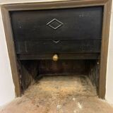 Marble fireplace surround with closed hearth frame.