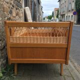 Wooden and rattan baby bed