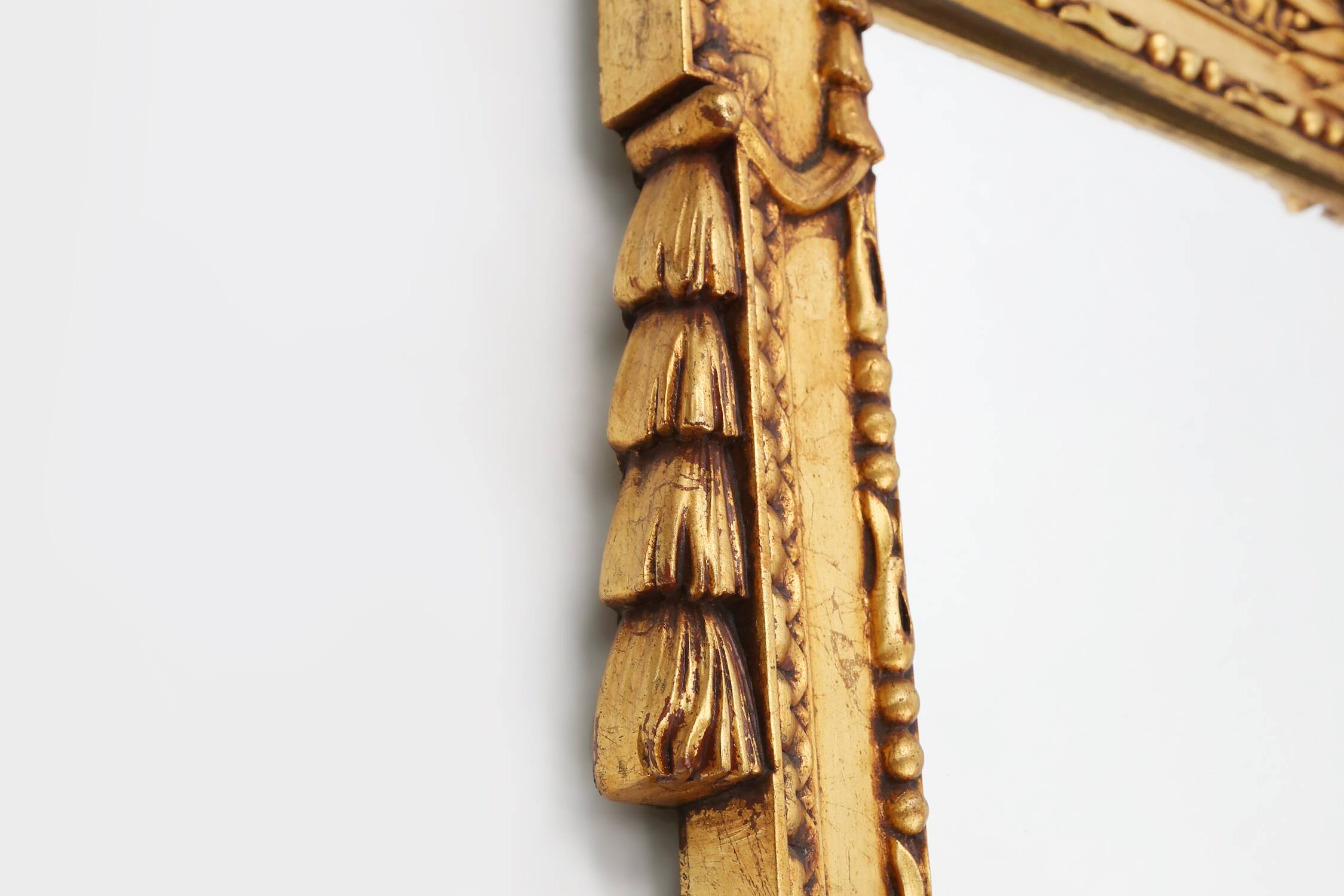 Highly decorated gilted carved wooden wall mirror, Belgium ca. 1950